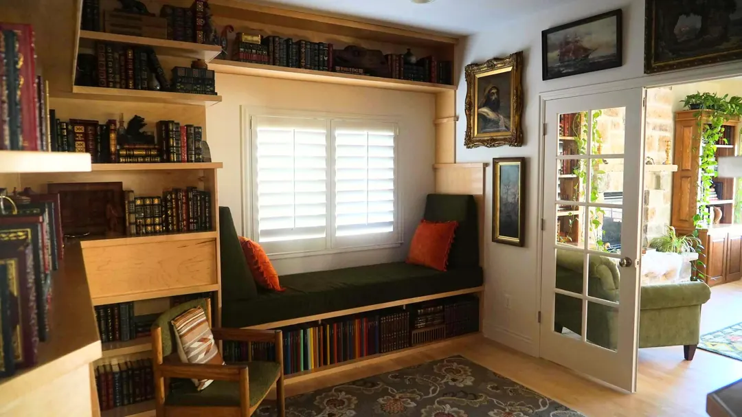 Custom built-in bookshelves around a window seat in a Heber City, Utah home